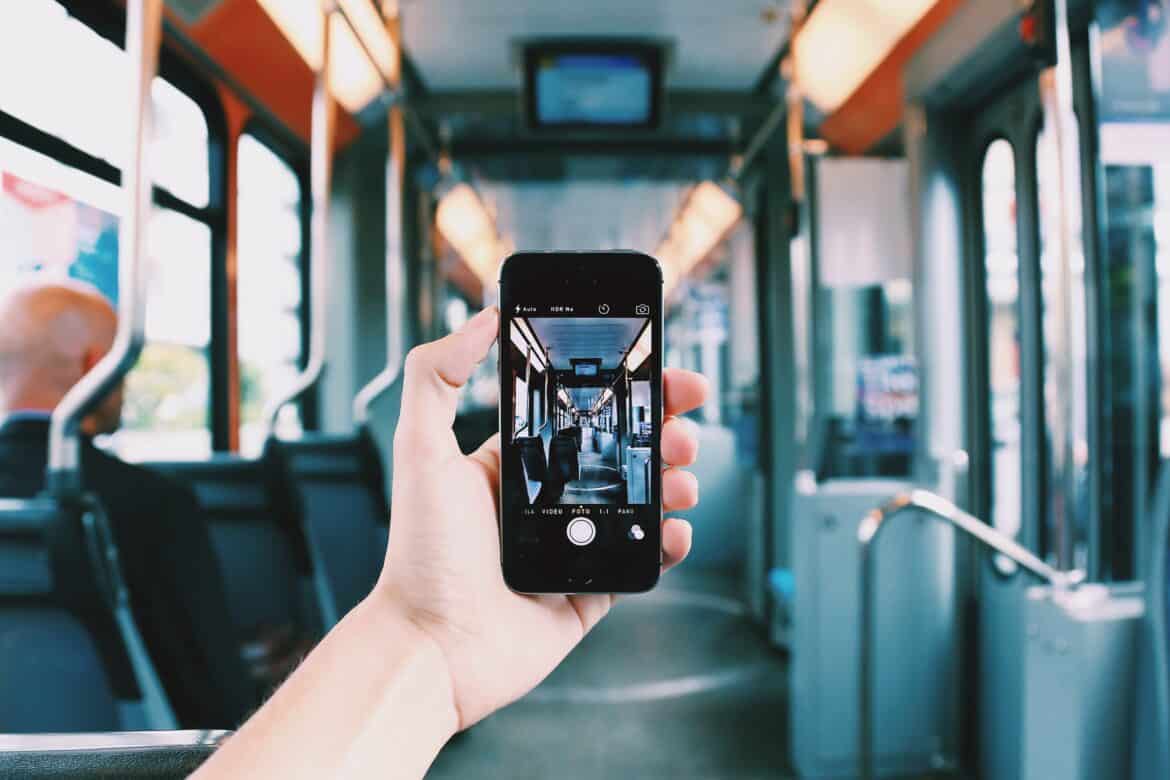 person-holding-smartphone-stockpack-pexels Person holding smartphone