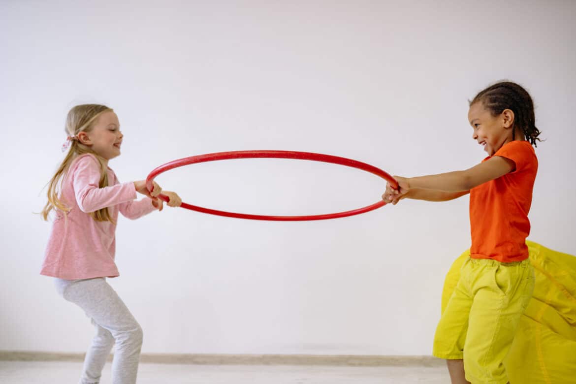 two-girls-holding-a-hula-hoop-stockpack-pexels Two girls holding a hula hoop
