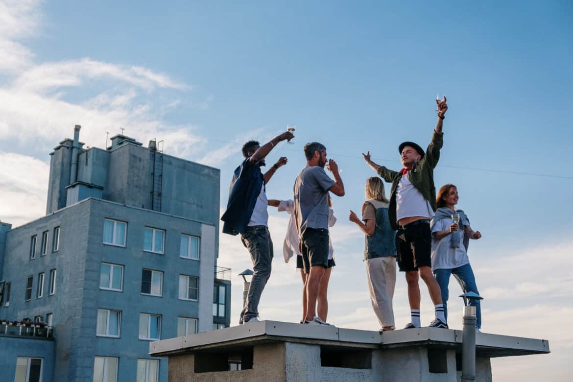 group-of-people-standing-on-top-of-building-stockpack-pexels Group of people standing on top of building