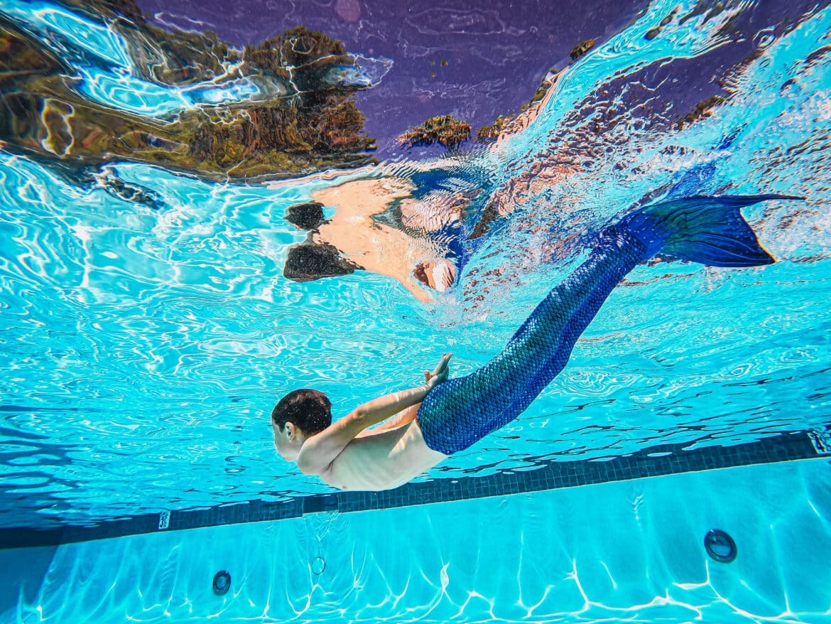 shirtless-person-wearing-a-mermaid-suit-swimming-stockpack-pexels Shirtless person wearing a mermaid suit swimming