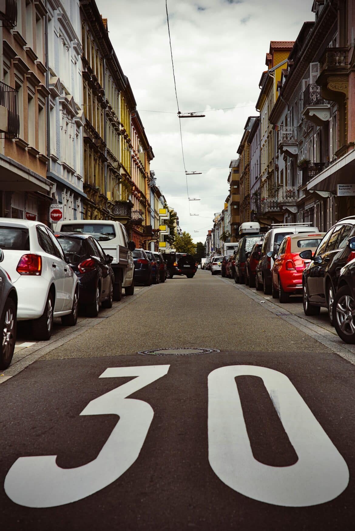 cars-parked-beside-buildings-stockpack-unsplash cars parked beside buildings