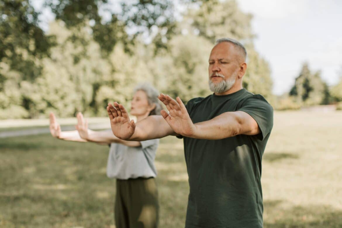 an-elderly-couple-doing-yoga-with-their-arms-outstretched-stockpack-pexels An elderly couple doing yoga with their arms outstretched