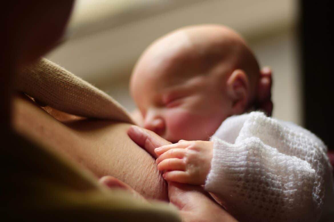 Intimate moment of breastfeeding in sao paulo